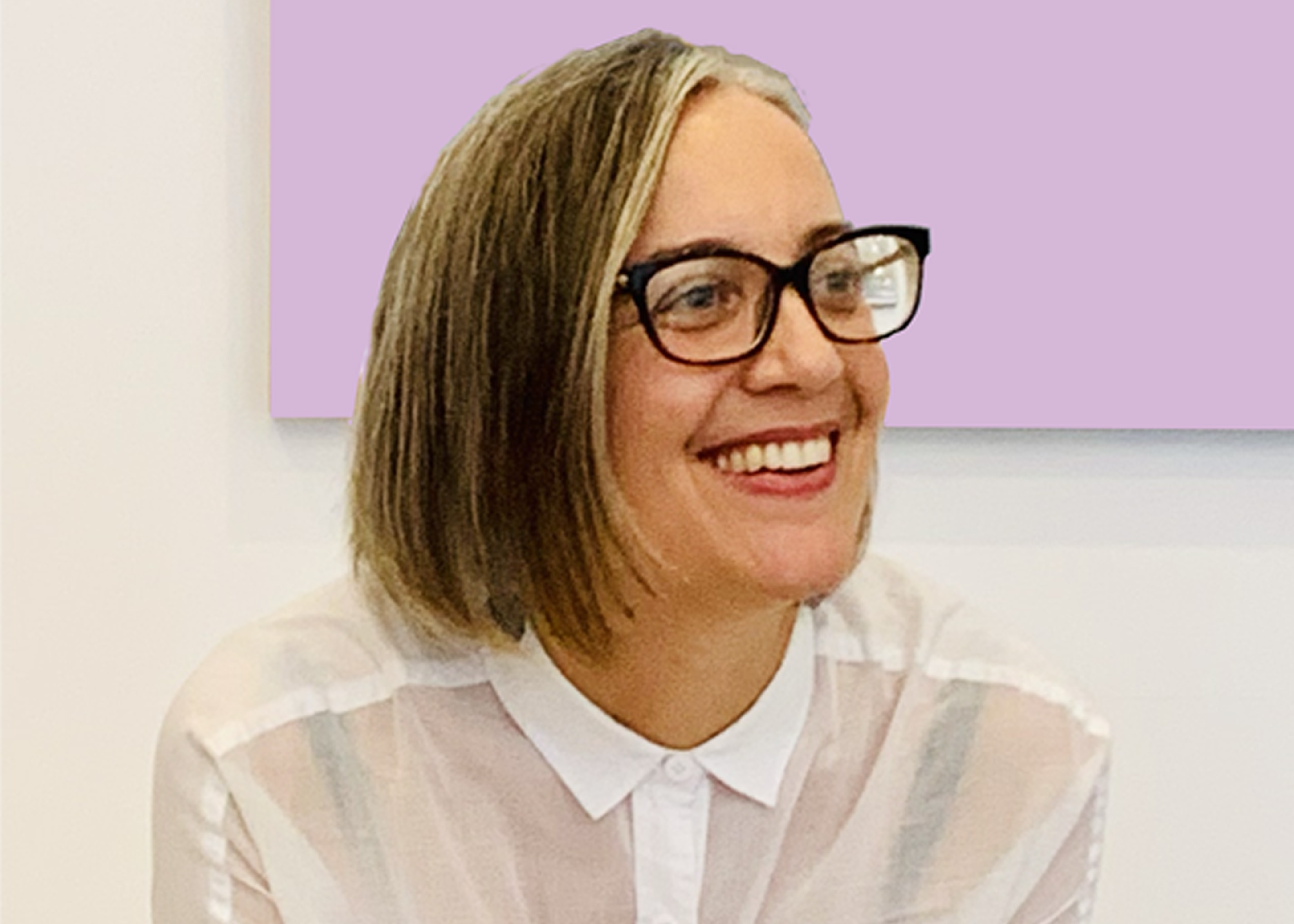 Photograph of artist Bianca Hester, a woman with shoulder length hair wearing a white shirt and glasses.