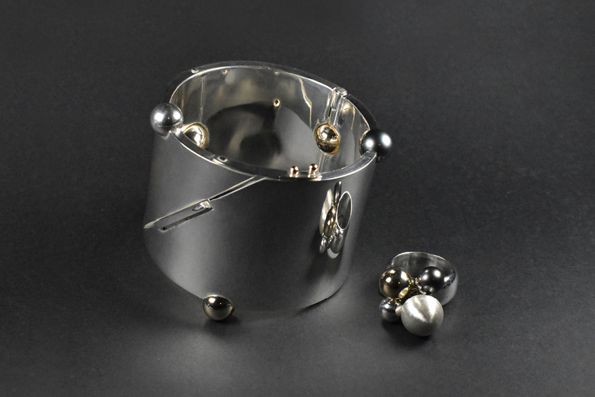 A silver cuff bracelet by artist Jacki Stone.