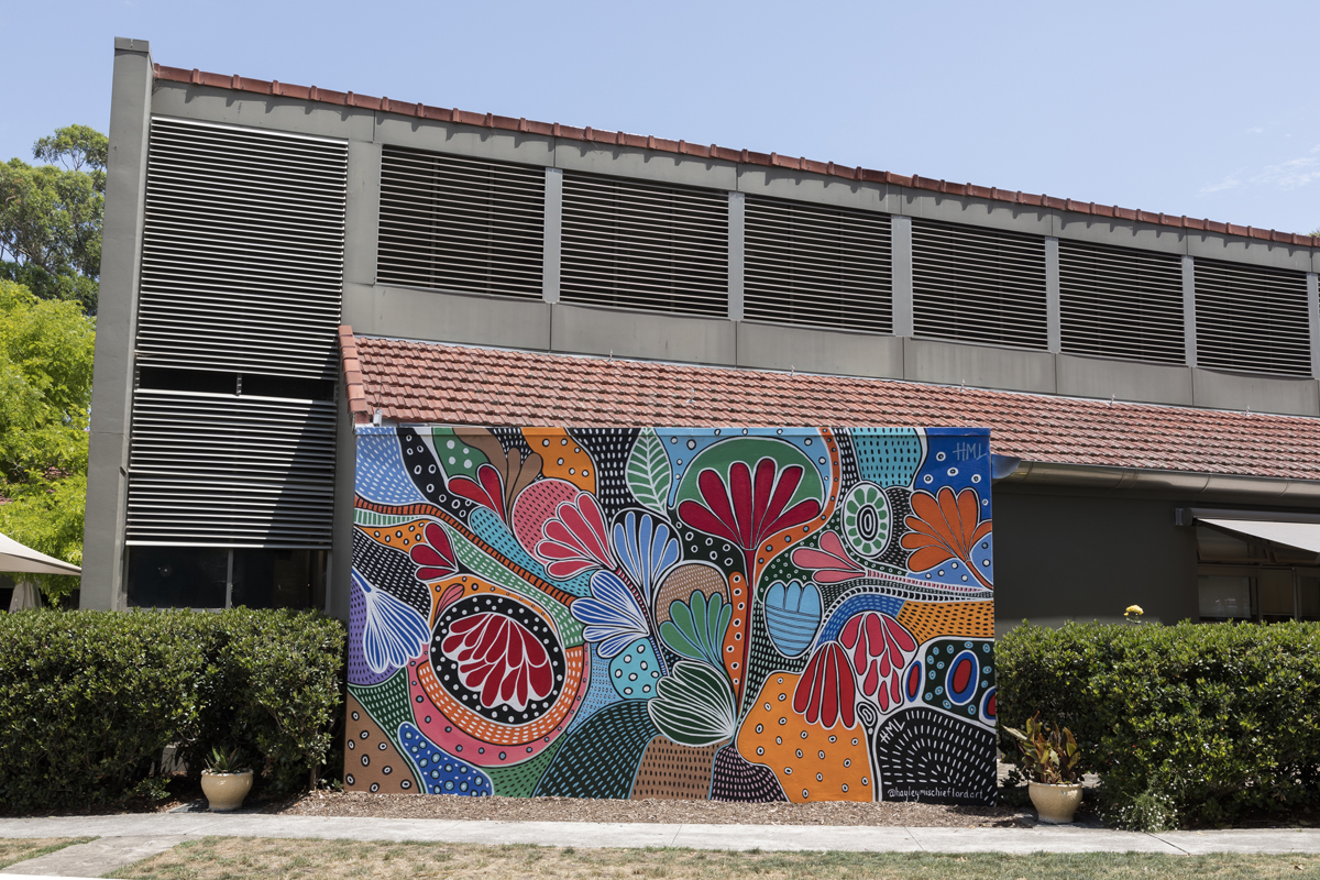 A large colourful outdoor mural inspired by nature.