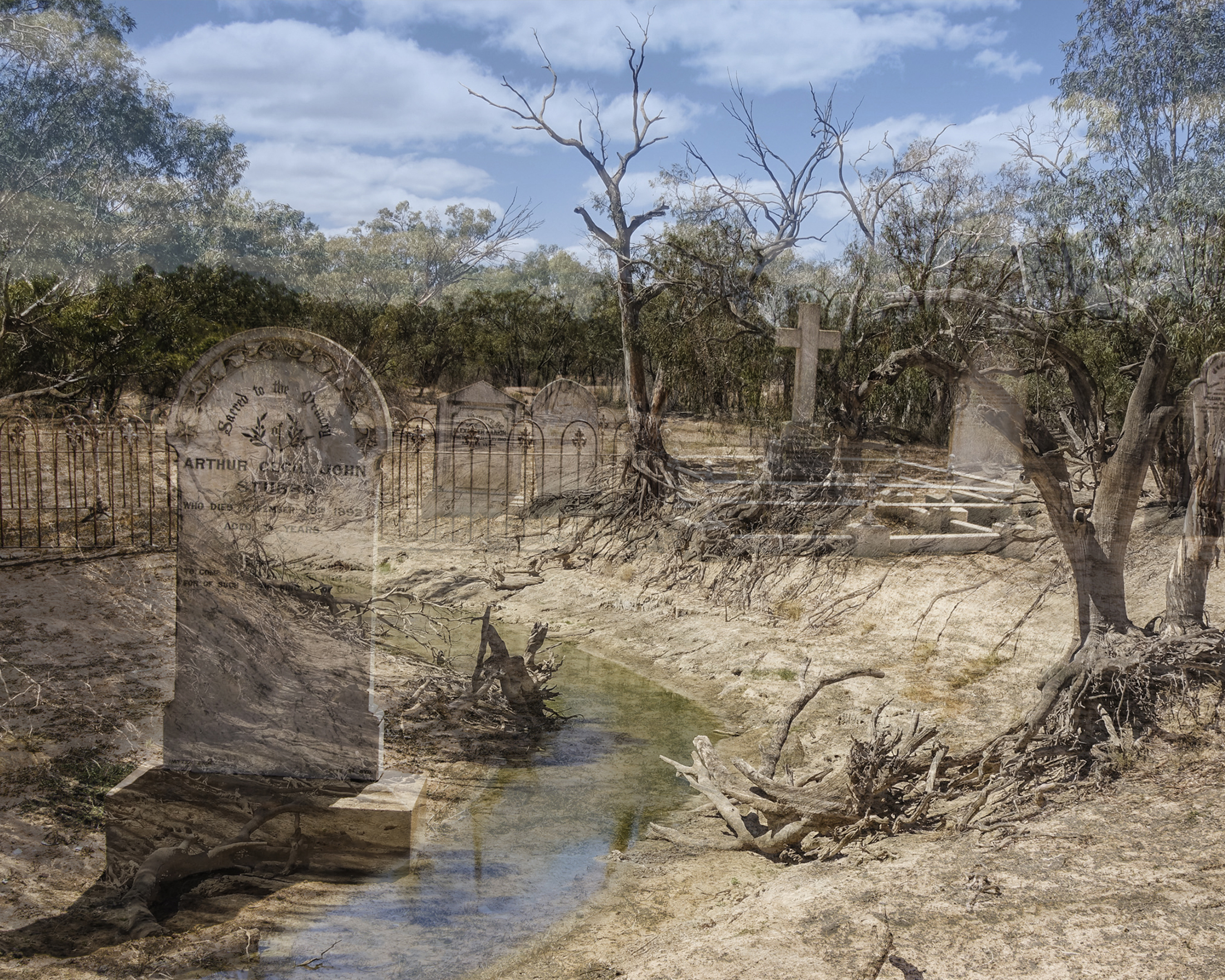 A 2-dimensional photo media artwork. Image features a dry riverbed scene overlayed with a cemetery scene of old tombstones.
