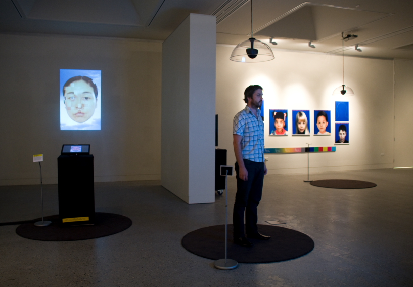 Man standing in interactive element of exhibition. 