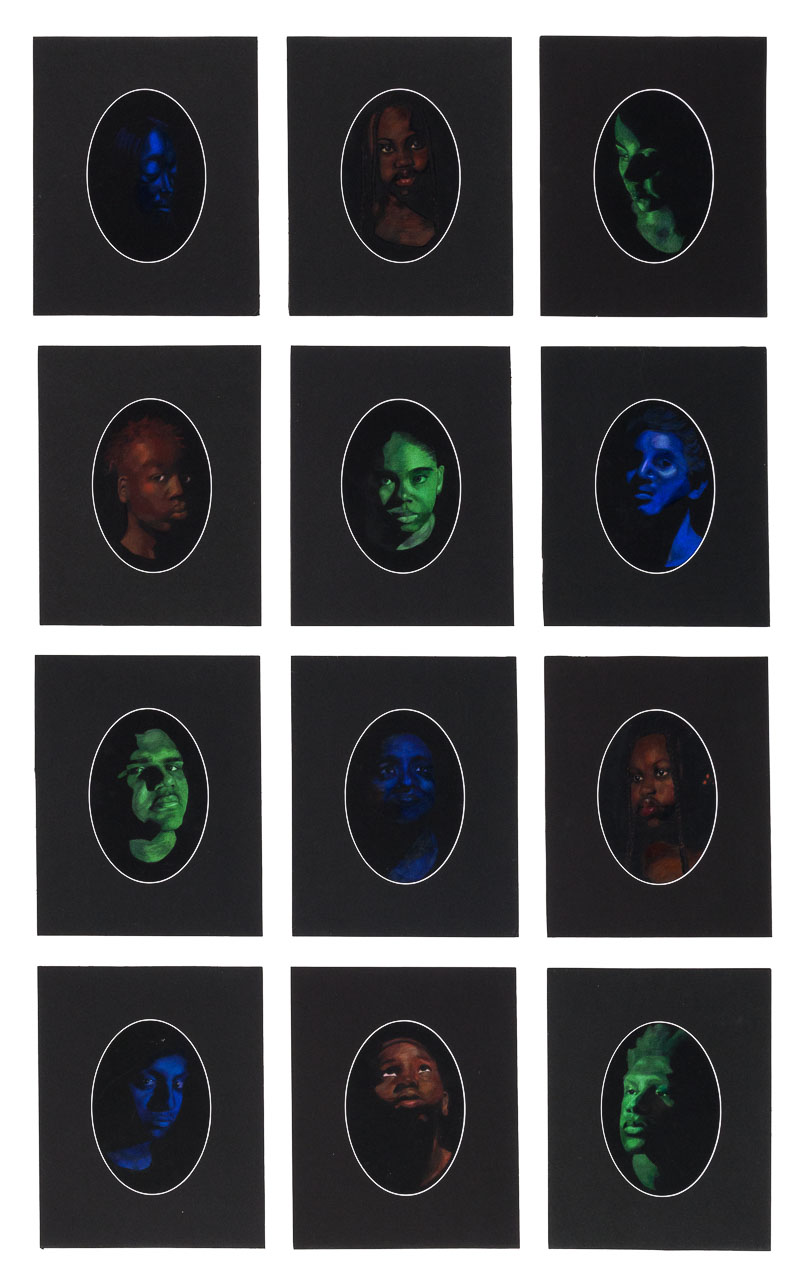 Twelve portraits of equal size made on black paper in the colours of red, green and blue. Each portrait is oval in shape and framed in black also.