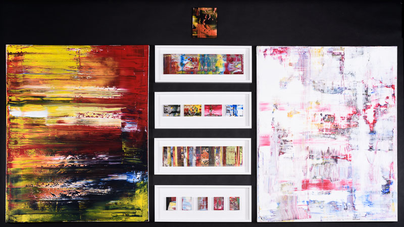A series of abstract paintings.
