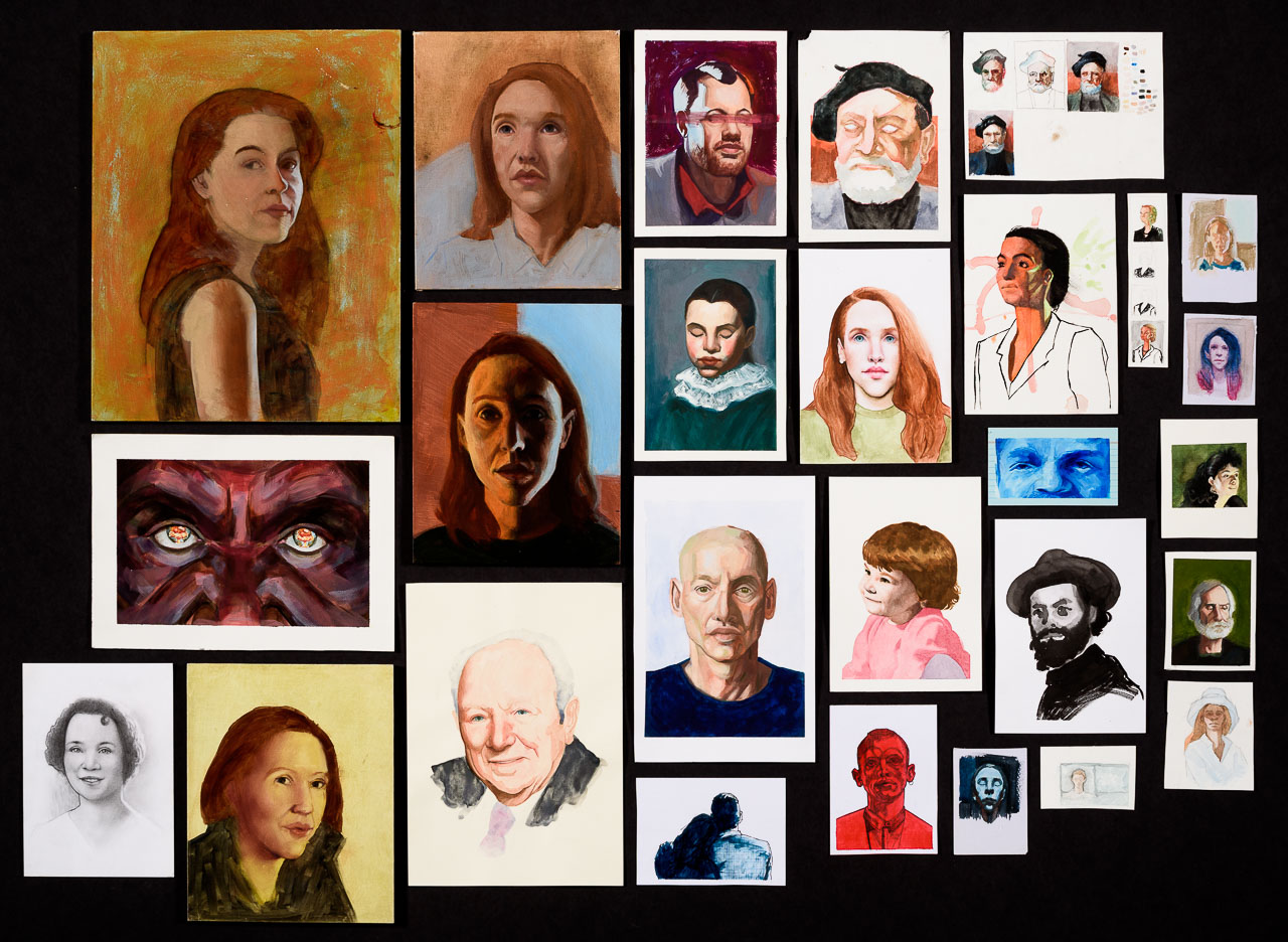 A collection of painted portraits in varying shapes and sizes of different people.