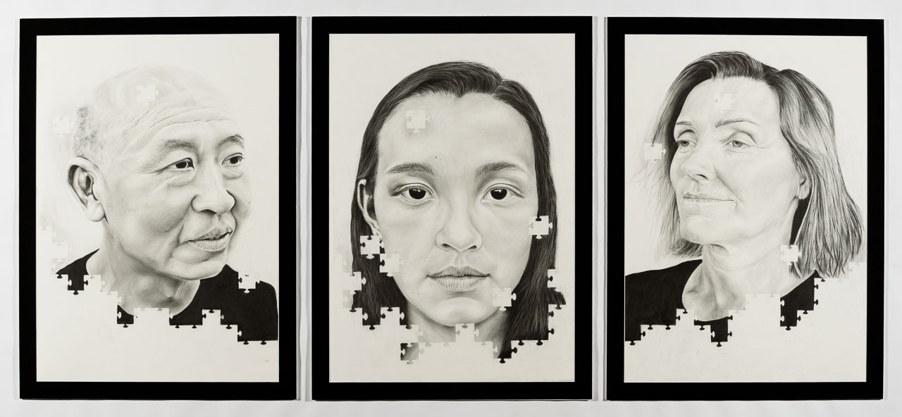 Three charcoal portraits with puzzle shapes pieces missing from the edges of each of the three faces.l