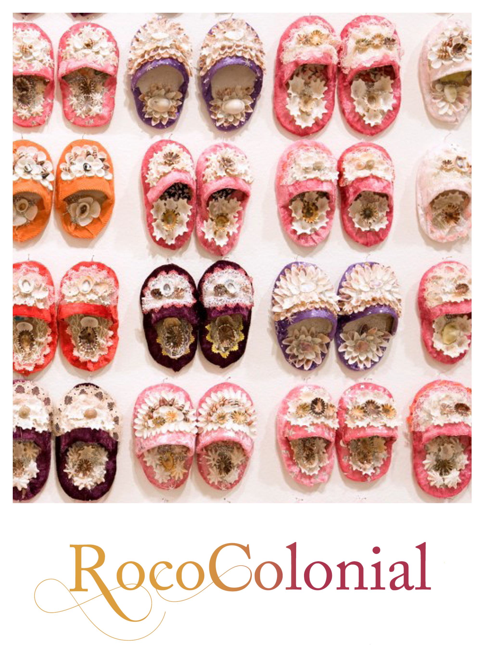 The cover of an exhibition catalogue featuring a photograph of sixteen pairs of shellwork baby shoes mounted in a grid on a wall. The baby shoes are in colours of pink, red and dark red and are by the Bidgigal artist Esme Timbery. The photograph takes up 3/4 of the cover and beneath is, on a white background the exhibition title 'Rococolonial' is written in a decorative font and colored with a gradient of yellow to red that runs across the word.